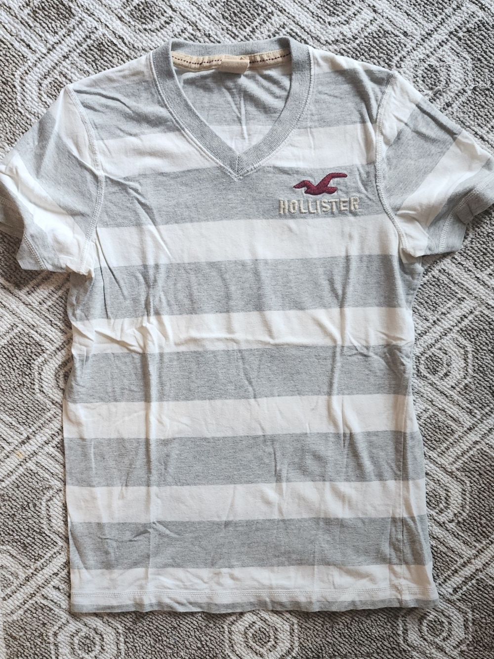 Hollister Men's Gray & White Striped V‑Neck Tee with Maroon Logo